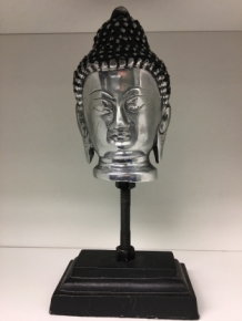 Buddha head on metal tripod, aluminum.