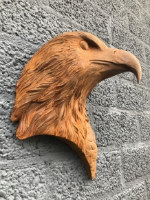 Eagle's head, cast iron wall ornament with rustic surface