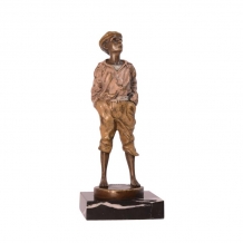A bronze statue/sculpture of a whistling boy