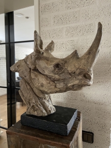 A beautiful head of a rhino, beautiful in detail, polystone wood look