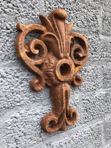 Wall anchor, cast iron, French lily shape.