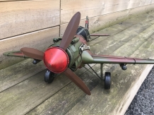 A metal scale model of a fighter plane