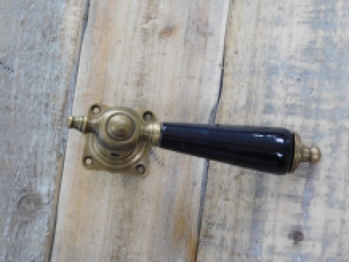 1 door handle brass with ceramic handle black and including mandrel.