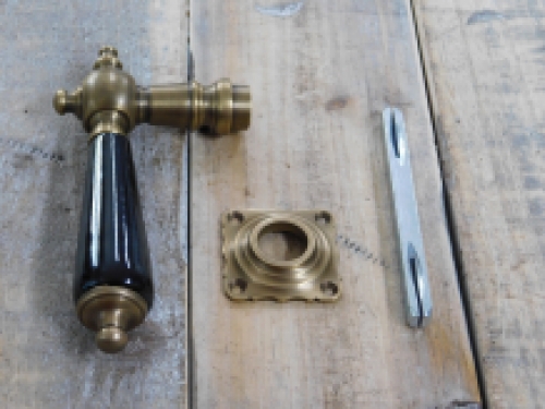 1 door handle brass with ceramic handle black and including mandrel.