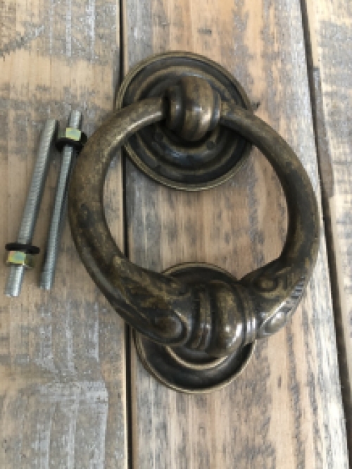 Door knocker, stylish and antique dark brass.