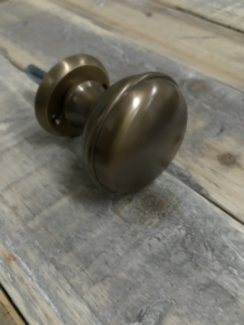 1 door knob with foot rosette, brass pat, is rotatable.