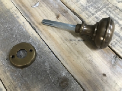 1 door knob with foot rosette, brass pat, is rotatable.