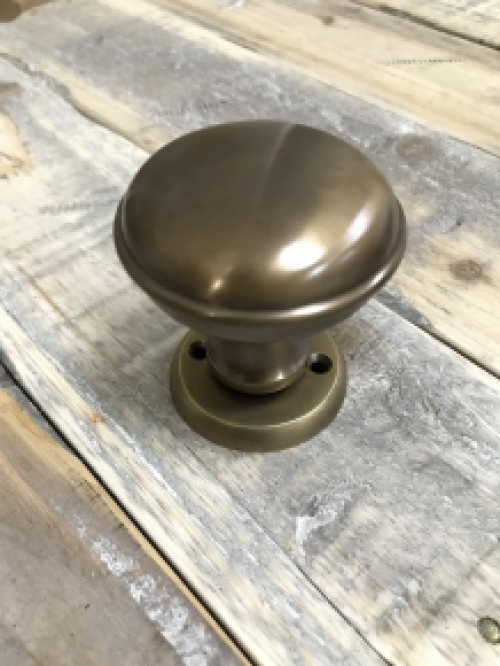 1 door knob with foot rosette, brass pat, is rotatable.