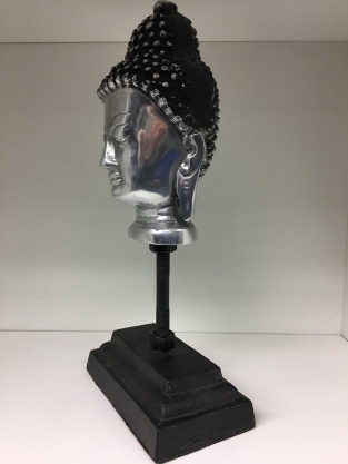 Buddha head on metal tripod, aluminum.