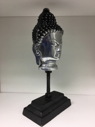 Buddha head on metal tripod, aluminum.