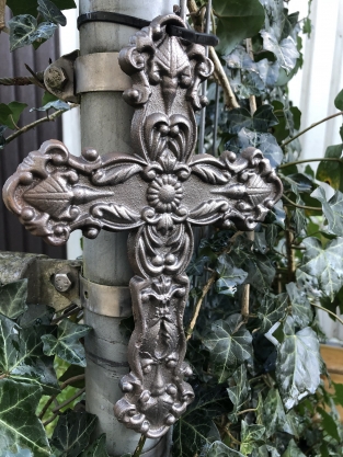 Cross made of cast iron, rusty