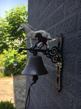 Doorbell horse with foal, cast iron