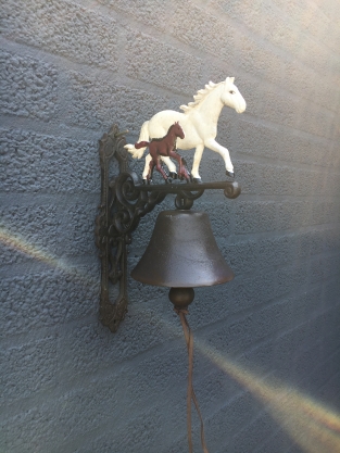 Doorbell horse with foal, cast iron