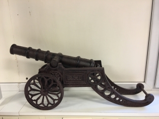 Beautiful decorative cannon, cast iron brown.