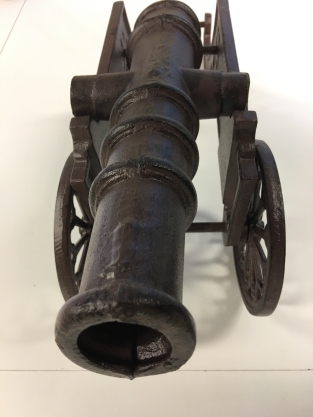 Beautiful decorative cannon, cast iron brown.