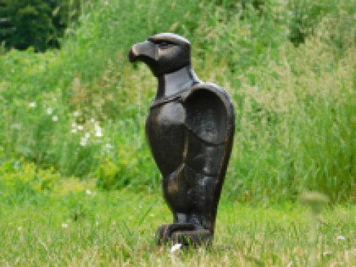 Eagle on wooden base - antique iron