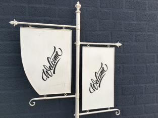 Welcome sign metal on stand, wrought iron white