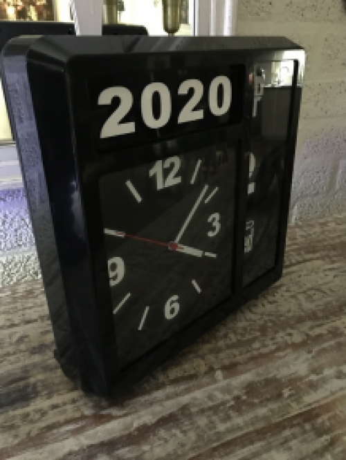 A ByBoo clock with year, date and time can stand, but can also be hung on the wall