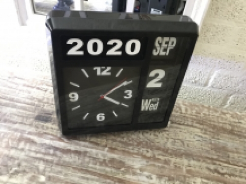 A ByBoo clock with year, date and time can stand, but can also be hung on the wall