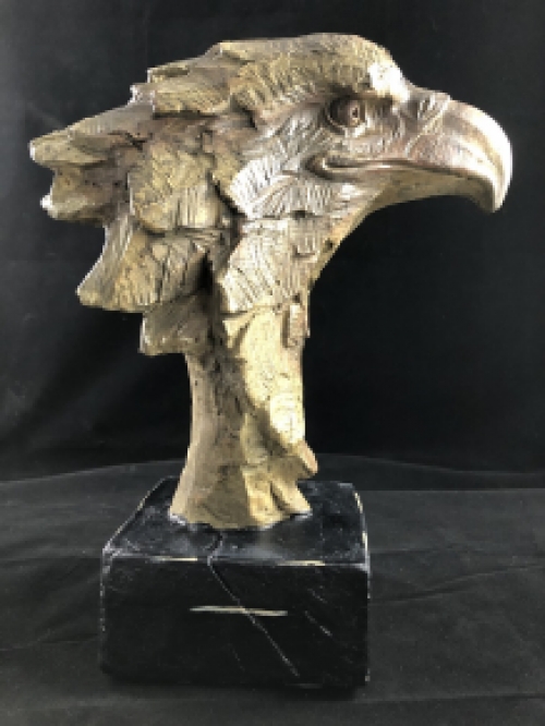 A beautiful head of an eagle, beautiful in detail, polystone wood look
