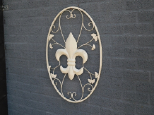 A large wrought iron wall ornament, the French Lily, antique-white