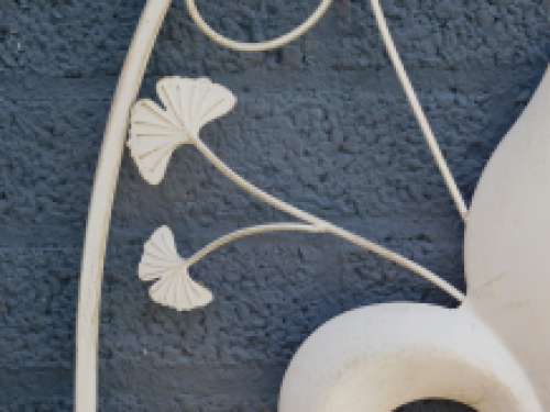 A large wrought iron wall ornament, the French Lily, antique-white