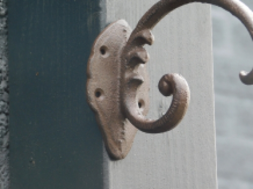 Cast iron hook with bird, brown, very beautiful to behold