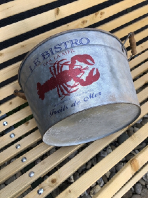 A very decorative, beautiful zinc bowl small with the text 