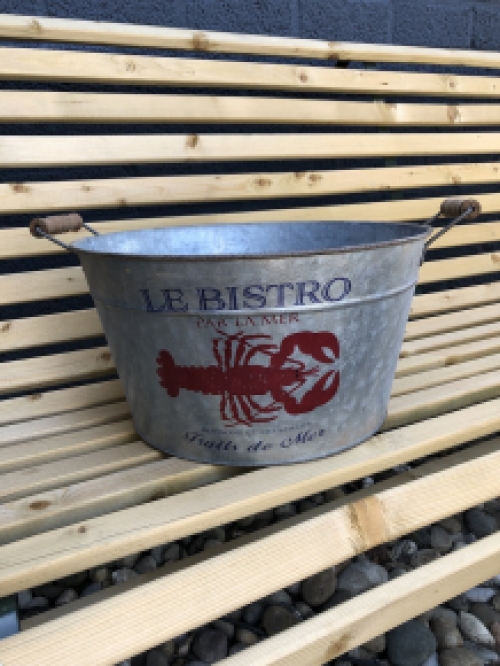A very decorative, beautiful zinc bowl small with the text 