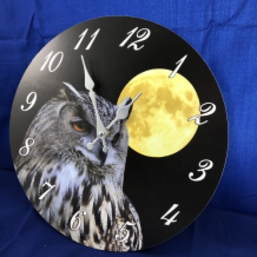 Wooden clock with an image of an owl