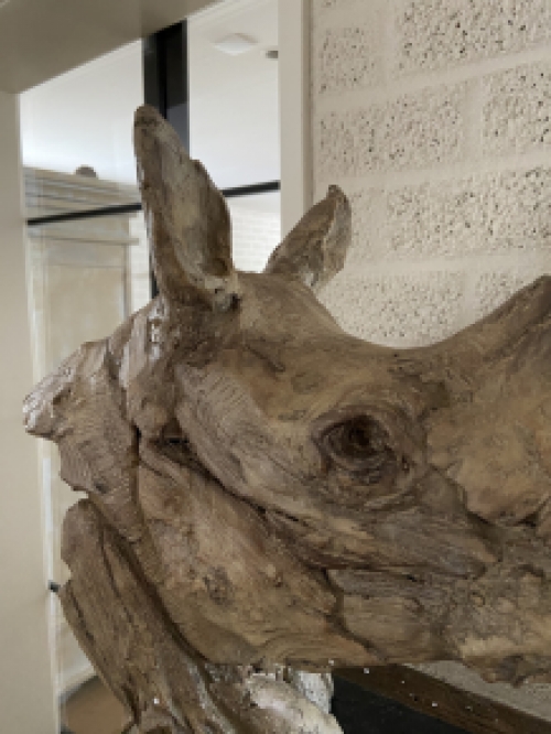 A beautiful head of a rhino, beautiful in detail, polystone wood look