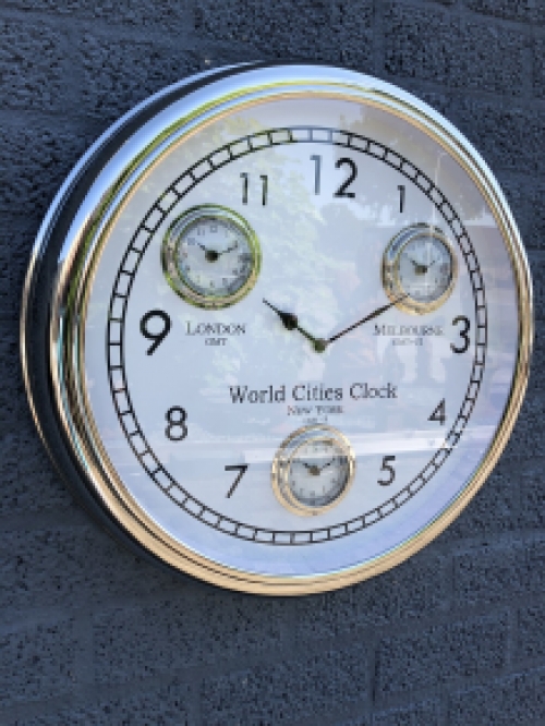 World time clock, chrome version with 4 movements, fantastic timepiece!!