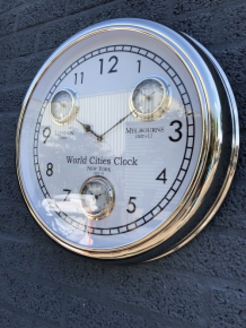 World time clock, chrome version with 4 movements, fantastic timepiece!!