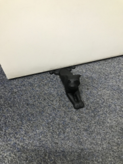 Door stopper in the shape of a dog, nice!
