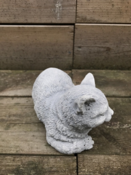 A beautiful lying cat, made of stone, beautiful in detail