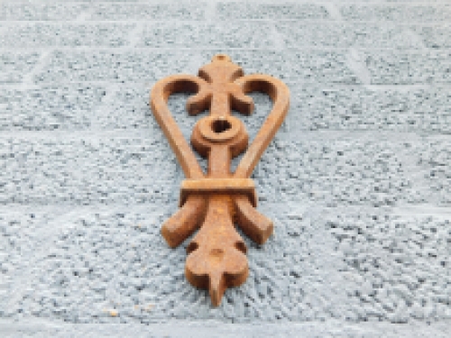 Wall anchor, cast iron, rust, heart shape.