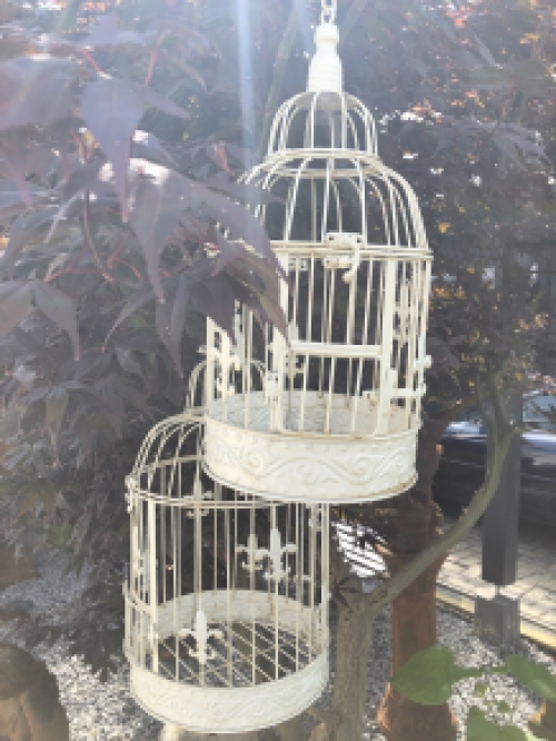 Set of beautiful round white metal bird cages very beautiful in