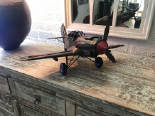 A metal scale model of a fighter plane
